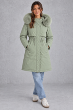 Women’s long hooded winter parka with faux fur trim, a plush-lined interior, adjustable drawstring waist and relaxed silhouette.