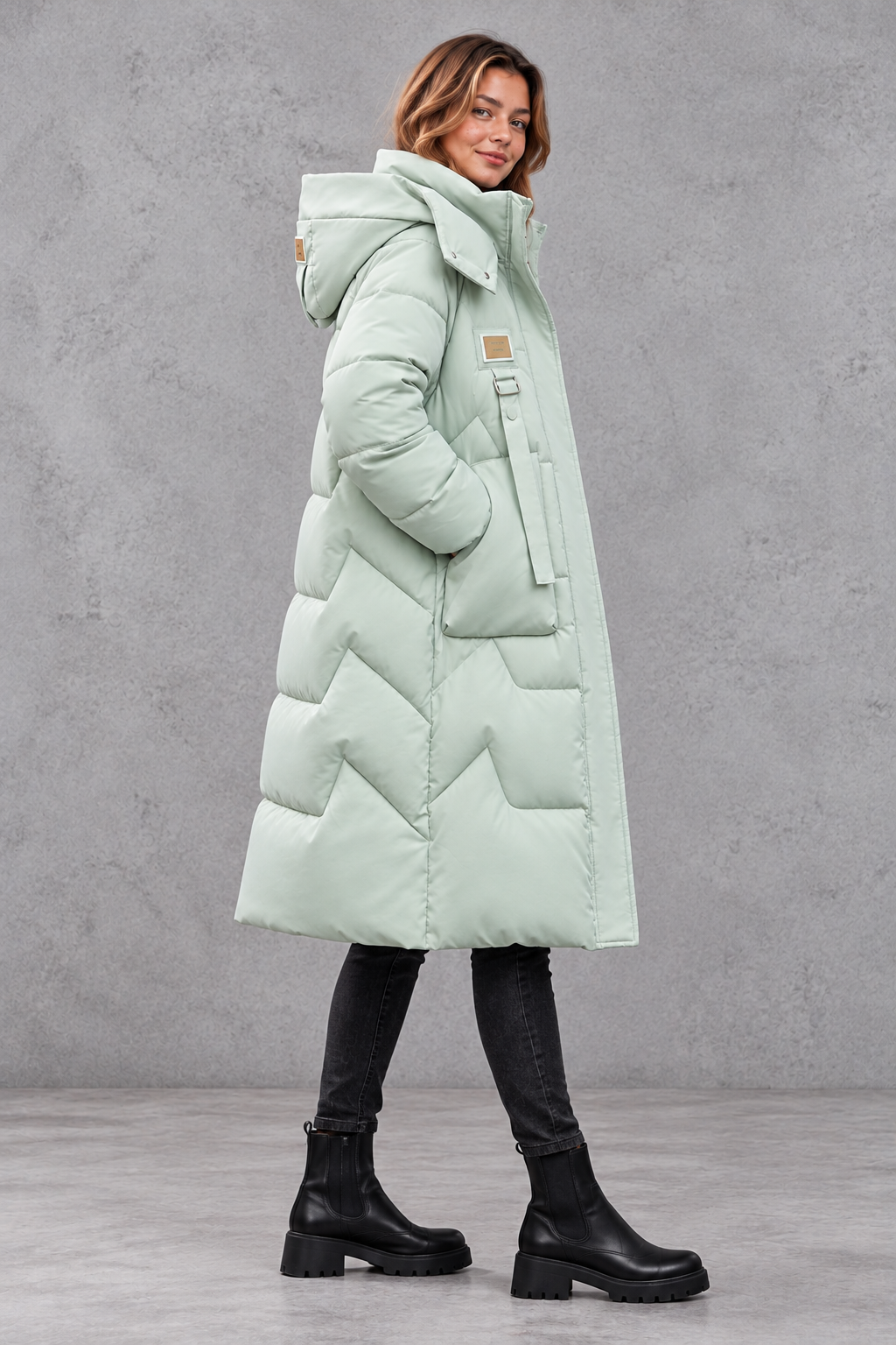 Women's long hooded puffer coat in Mint Green – side view