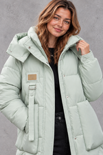 Women's long hooded puffer coat in Mint Green – close-up
