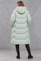 Women's long hooded puffer coat in Mint Green – back view