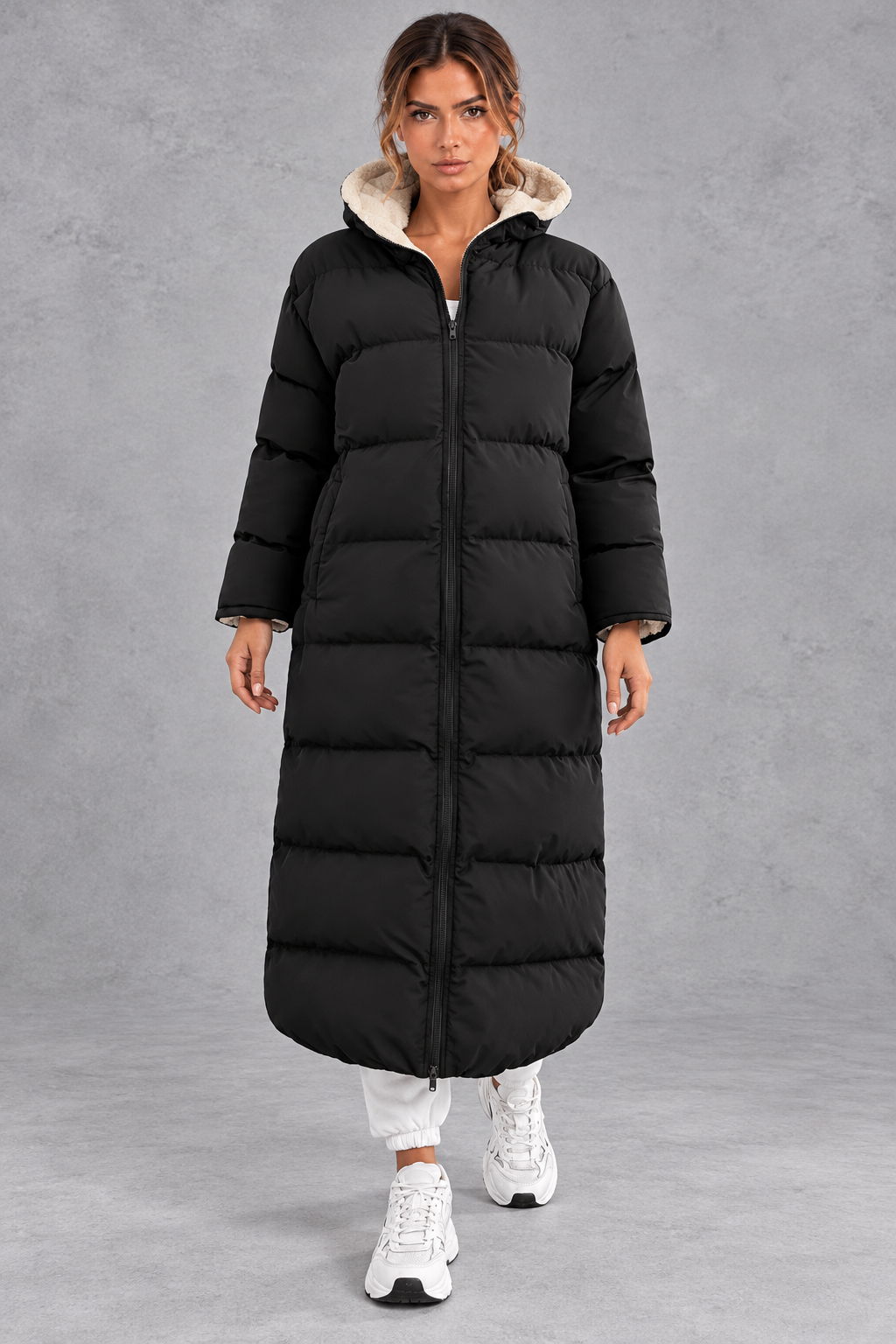 Women's long hooded puffer coat in Black – front view