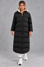Women's long hooded puffer coat in Black – front view