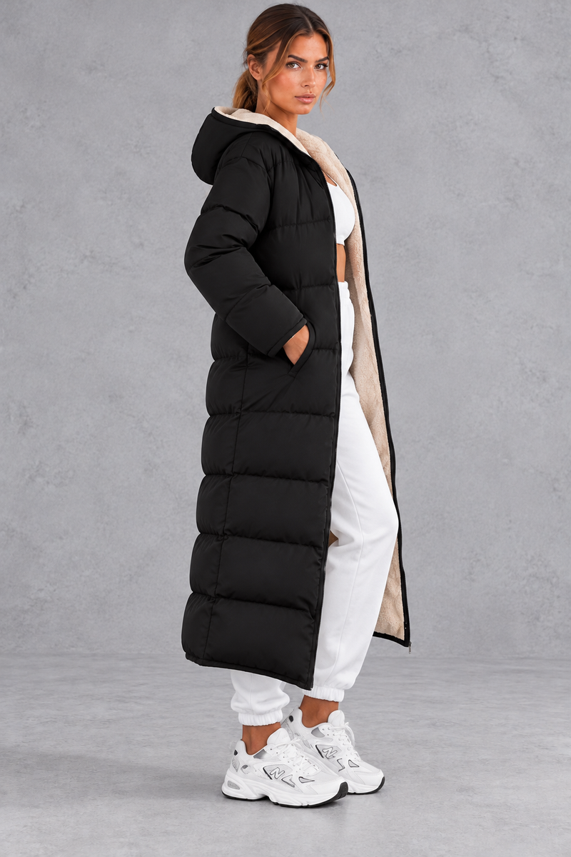 Women's long hooded puffer coat in Black – side view