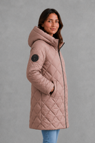 Women’s long quilted winter coat with lightweight thermal padding, protective hood, high collar and an elegant longline silhouette.