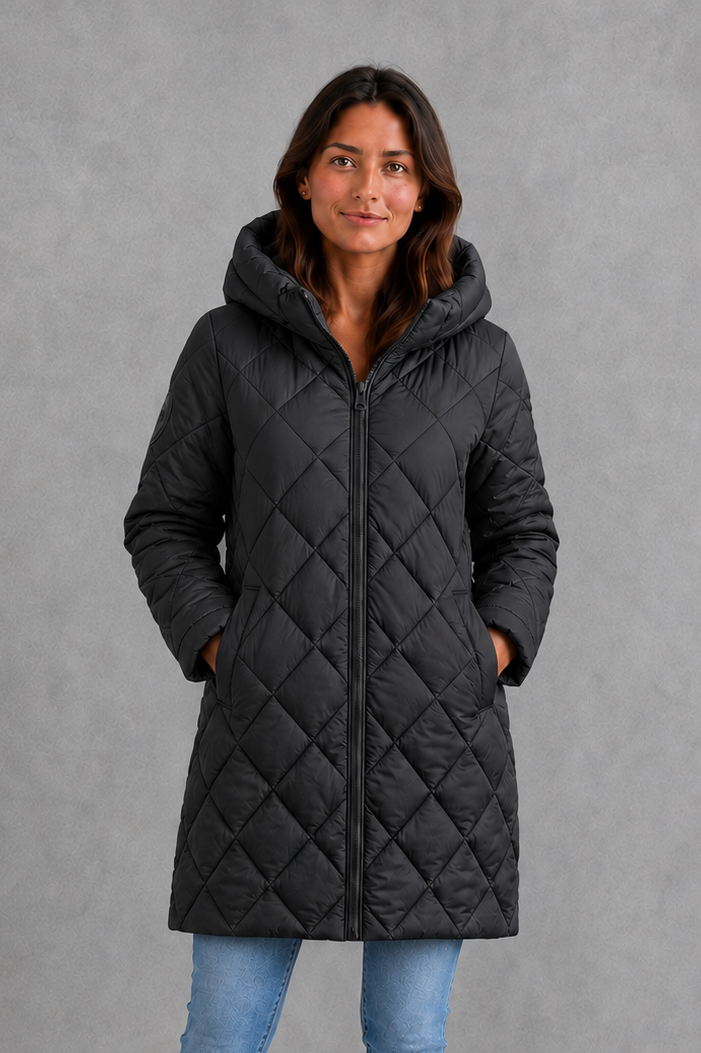 Women’s long quilted winter coat with lightweight thermal padding, protective hood, high collar and an elegant longline silhouette.