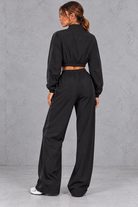 Women's black cropped zip-up jacket and wide leg trouser fitness set – back view