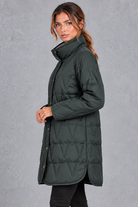 Women's longline quilted down coat in Dark Green – side view