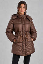 Women’s longline hooded puffer coat with quilted padding, a high neckline, adjustable drawstring waist and practical side pockets.