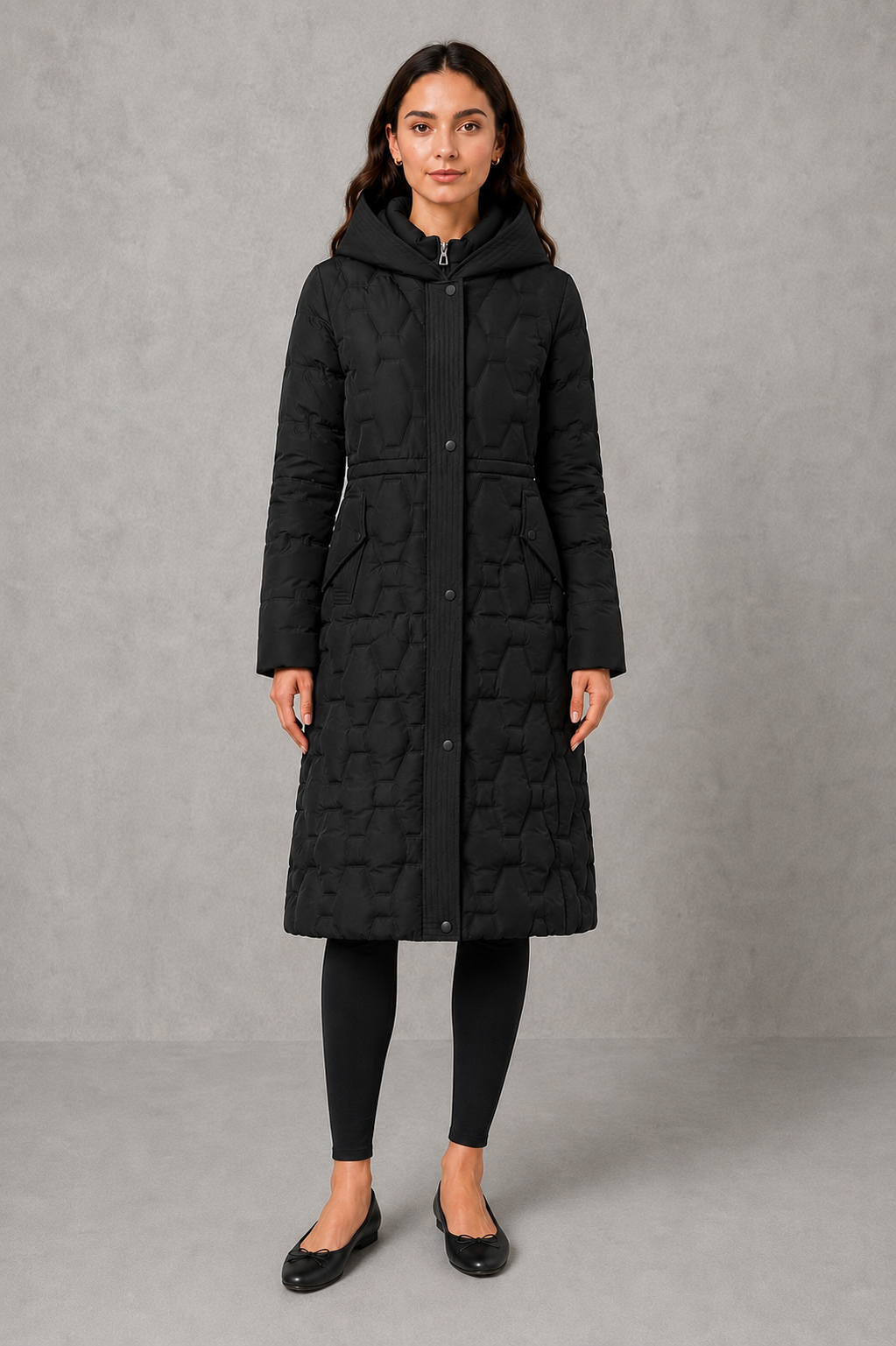 Women’s longline hooded puffer coat with insulated padding, waterproof and windproof protection, practical pockets and extended winter coverage.