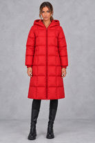 Women’s longline hooded puffer winter coat with streamlined quilting, a high neckline, full zip front and practical side pockets.