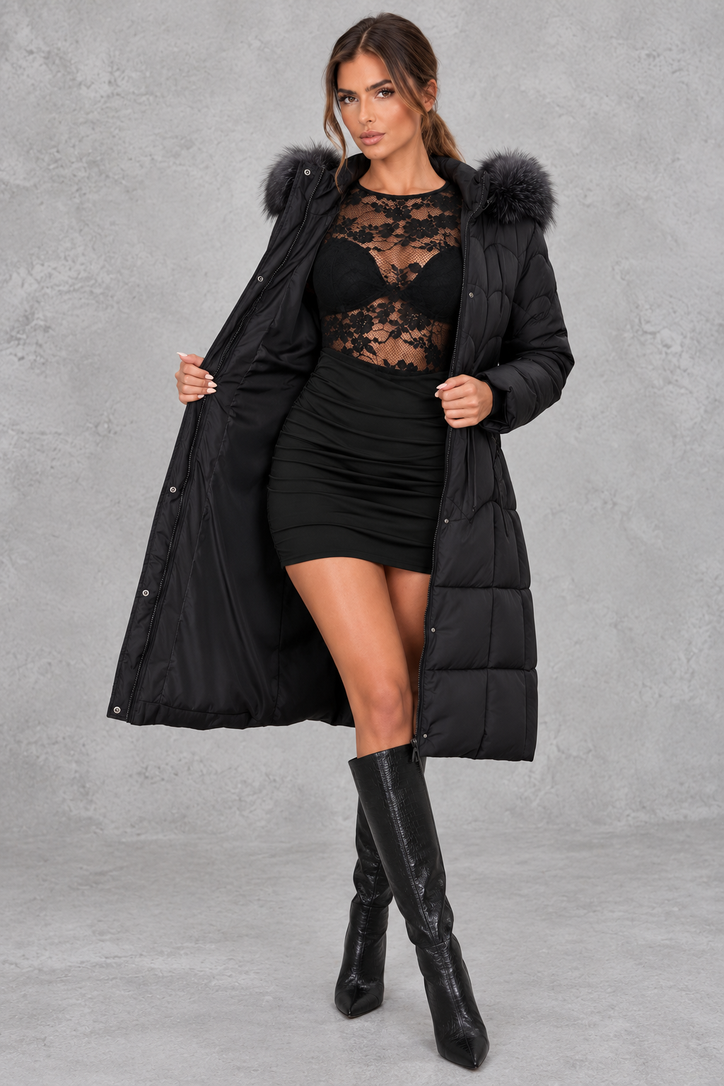 Women’s longline quilted puffer coat with a detachable faux fur hood, adjustable drawstring waist and warm padded construction.