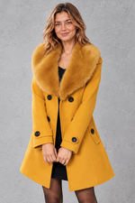 Women's longline winter coat with faux fur collar in Yellow – front view