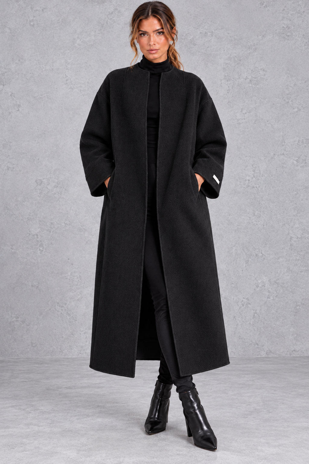 Women's longline wool-blend coat in Black – front view
