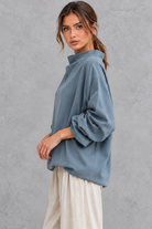 Women’s loose roll neck long sleeve jumper with a solid-colour finish and relaxed everyday silhouette – image 2