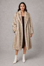 Women’s luxe faux fur coat with a plush voluminous texture and glamorous statement silhouette for elegant autumn and winter styling.