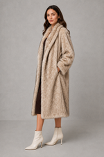 Women’s luxe faux fur coat with a plush voluminous texture and glamorous statement silhouette for elegant autumn and winter styling.
