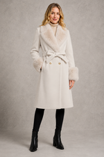 Women's blue luxury longline belted coat crafted from a wool and cashmere blend, featuring removable fox fur trim on the collar and cuffs, tailored silhouette, waist belt and full-length winter design.