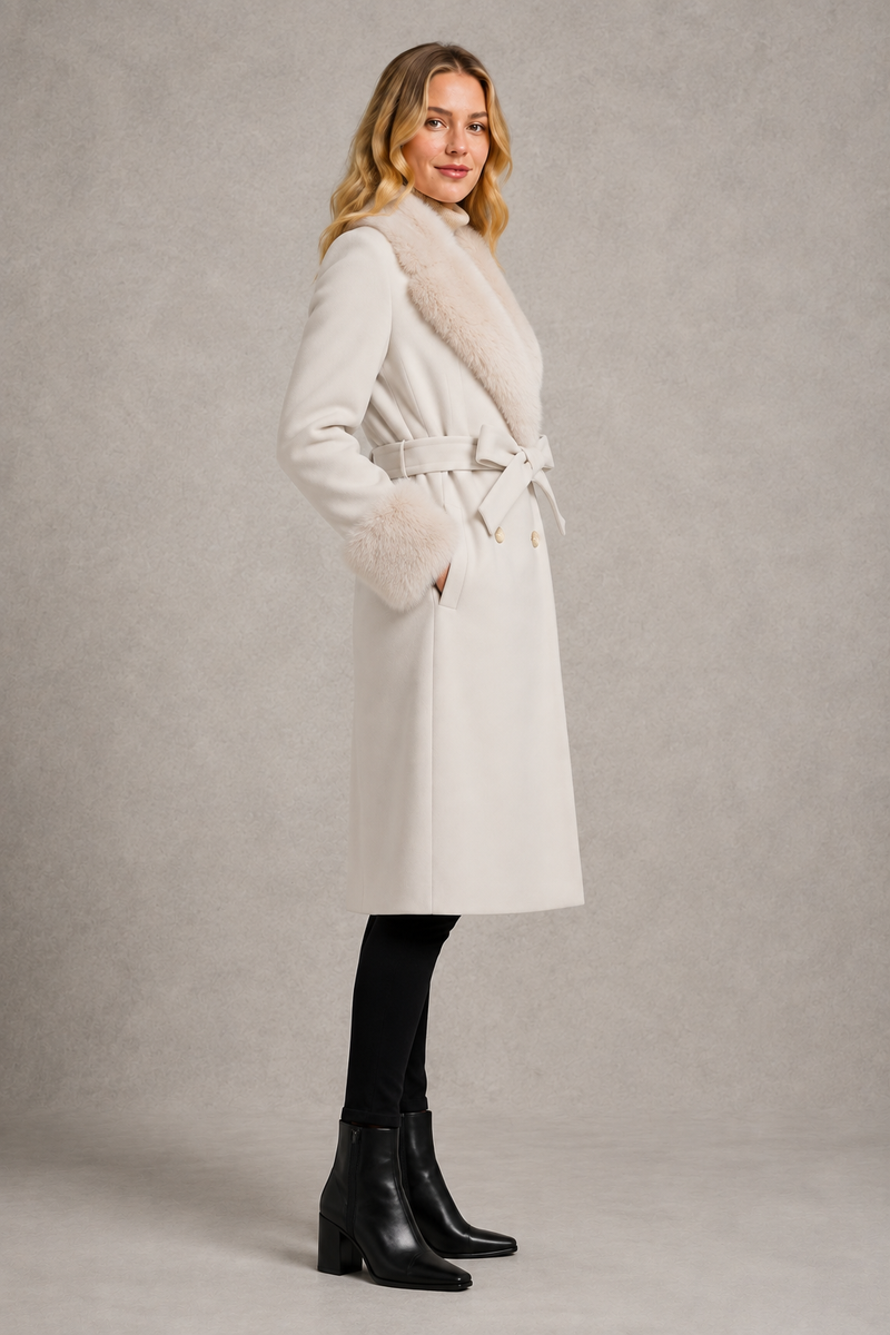 Women's blue luxury longline belted coat crafted from a wool and cashmere blend, featuring removable fox fur trim on the collar and cuffs, tailored silhouette, waist belt and full-length winter design.