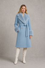 Women's blue luxury longline belted coat crafted from a wool and cashmere blend, featuring removable fox fur trim on the collar and cuffs, tailored silhouette, waist belt and full-length winter design.