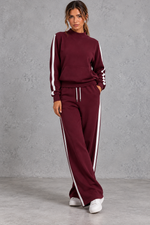 Women's burgundy mock neck wide leg tracksuit set with side stripes – front view