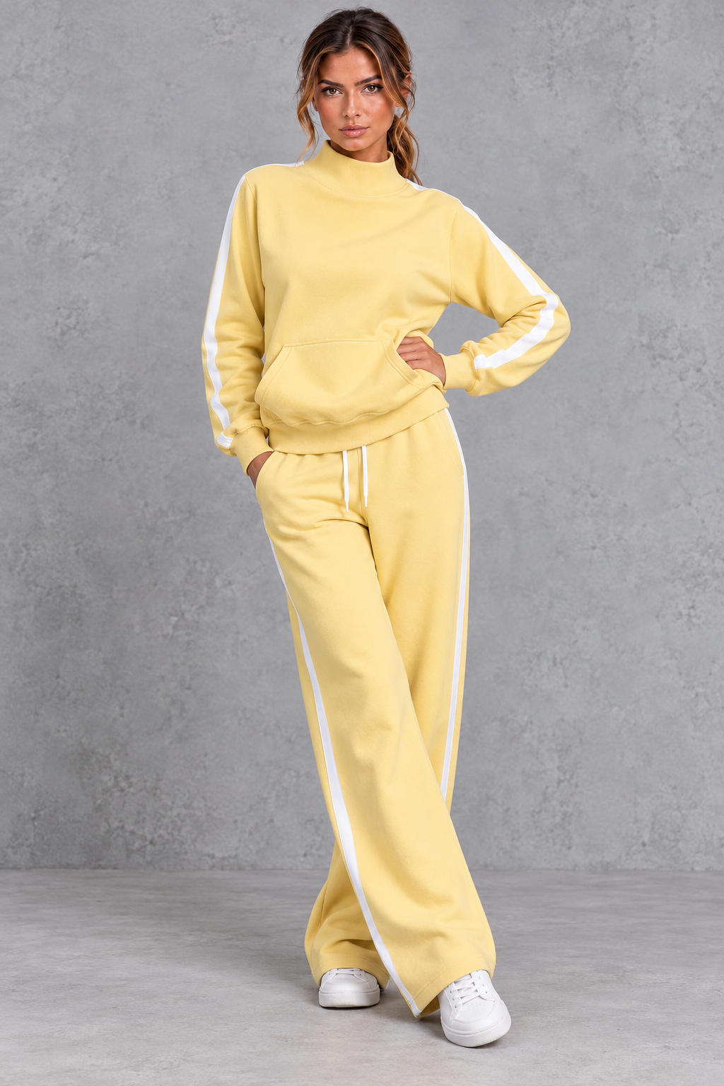Women's yellow mock neck wide leg tracksuit set with side stripes – front view