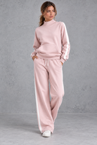 Women's pink mock neck wide leg tracksuit set with side stripes – front view