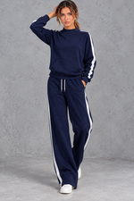Women's navy blue mock neck wide leg tracksuit set with side stripes – front view