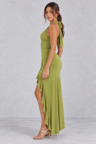 Women’s olive green halter maxi dress with a plunging V-neck, ruched twist waist, thigh-high split and flowing high-low hem.