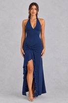 Women’s olive green halter maxi dress with a plunging V-neck, ruched twist waist, thigh-high split and flowing high-low hem.