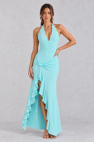 Women’s olive green halter maxi dress with a plunging V-neck, ruched twist waist, thigh-high split and flowing high-low hem.