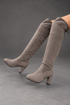 Women's over-the-knee boots in Grey – seated side view