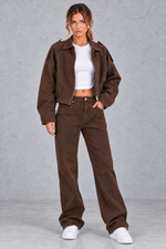 Women's brown oversized cropped bomber jacket with matching wide leg jeans – full-length view