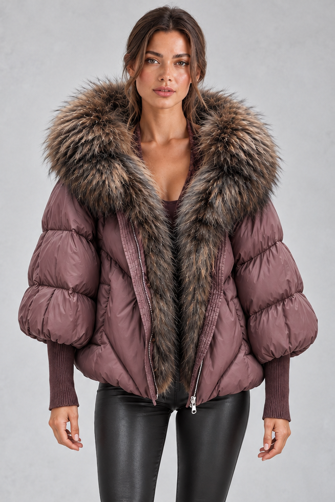 Women’s oversized puffer jacket with a plush faux fur-trimmed hood, voluminous padding, dropped shoulders and extended ribbed cuffs.