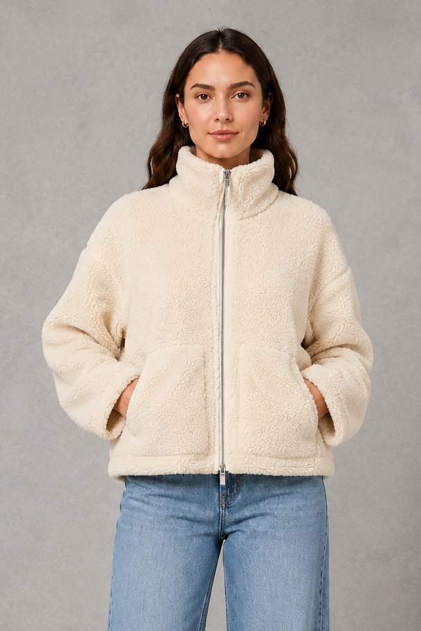 Women’s oversized teddy fleece jacket with a soft plush texture, full zip fastening, relaxed fit and practical front pockets.
