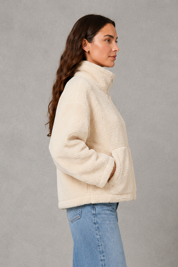 Women’s oversized teddy fleece jacket with a soft plush texture, full zip fastening, relaxed fit and practical front pockets.