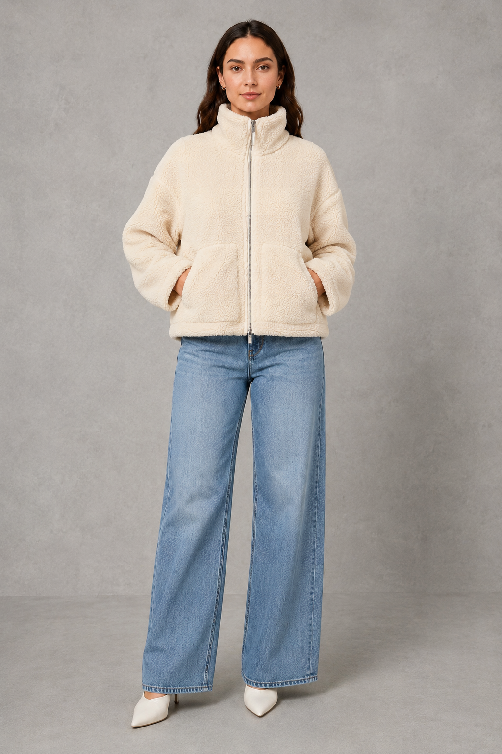 Women’s oversized teddy fleece jacket with a soft plush texture, full zip fastening, relaxed fit and practical front pockets.