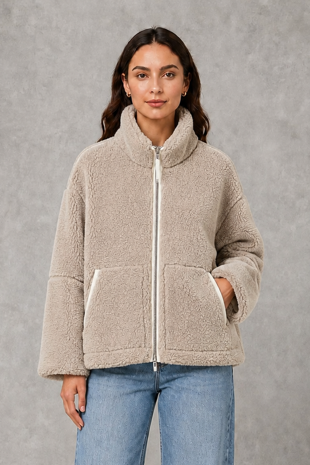 Women’s oversized teddy fleece jacket with a soft plush texture, full zip fastening, relaxed fit and practical front pockets.