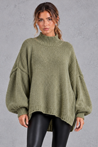Women's green oversized high neck balloon sleeve jumper – front view