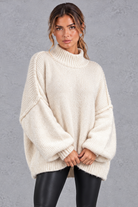 Women's apricot oversized high neck balloon sleeve jumper – front view