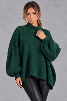 Women's dark green oversized high neck balloon sleeve jumper – front view