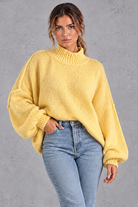 Women's yellow oversized high neck balloon sleeve jumper – front view
