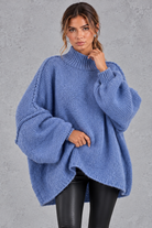 Women's denim blue oversized high neck balloon sleeve jumper – front view
