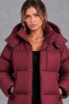Women's oversized hooded puffer jacket in Wine Red – close-up