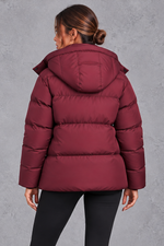 Women's oversized hooded puffer jacket in Wine Red – back view
