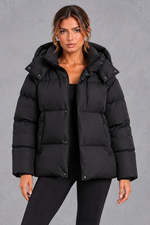 Women's oversized hooded puffer jacket in Black – front view
