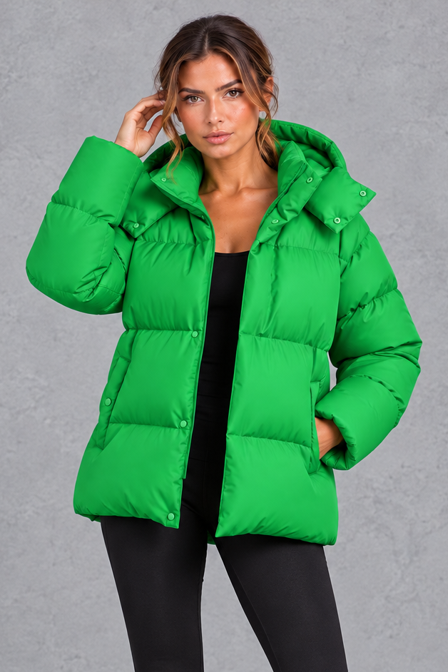 Women's oversized hooded puffer jacket in Green – front view
