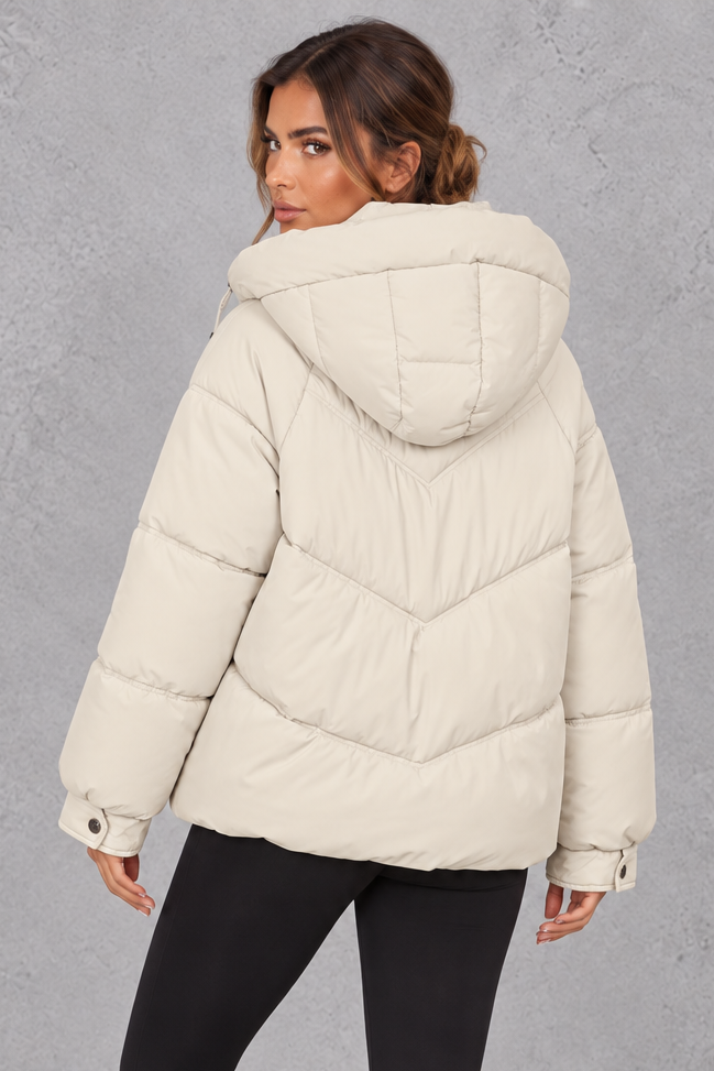 Women’s cream oversized hooded puffer jacket with geometric quilting, generous padding, a high collar and adjustable drawcord hem.