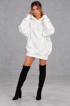 Women's white oversized hoodie mini dress with drawstring hood and kangaroo pocket – front view