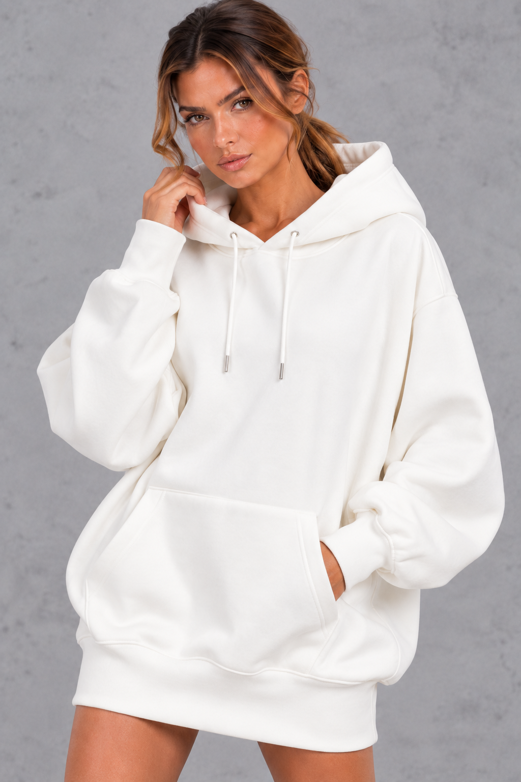 Women's white oversized hoodie dress – close-up of drawstring hood and front pocket