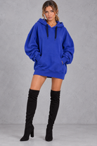Women's royal blue oversized hoodie mini dress with drawstring hood and kangaroo pocket – front view